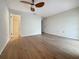 Spacious bedroom with laminate wood flooring and access to bathroom at 1333 Shady Pine Way # D, Tarpon Springs, FL 34688