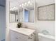 Bright bathroom with updated vanity and mirrored medicine cabinet at 3713 Champagne Dr # 115, Tampa, FL 33618