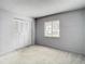 Bedroom featuring carpet, window, and double closets at 3713 Champagne Dr # 115, Tampa, FL 33618