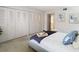 Main bedroom with large closets and a comfortable bed at 3713 Champagne Dr # 115, Tampa, FL 33618