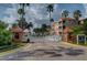 Gated entrance to community with palm trees and landscaping at 5000 Culbreath Key Way # 1-203, Tampa, FL 33611