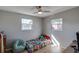 Bright bedroom with a large window, wood floor, toys, and a beanbag chair at 9322 88Th Way, Seminole, FL 33777