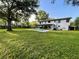 Spacious backyard features a pool and lush green grass at 1003 W River Heights Ave, Tampa, FL 33603