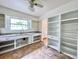 Kitchen with white cabinets, granite counters, and open shelving at 1003 W River Heights Ave, Tampa, FL 33603