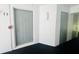 Building hallway with fire alarm and unit door at 1308 Pine Ridge E Cir # E3, Tarpon Springs, FL 34688