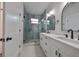 Modern bathroom with double vanity and walk-in shower at 1906 Cherry W St # 1, Tampa, FL 33607