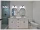 Bathroom with double vanity, marble countertops and walk-in shower at 1906 Cherry W St # 1, Tampa, FL 33607