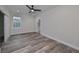 Spacious bedroom with wood-look floors and en-suite bathroom at 1906 Cherry W St # 1, Tampa, FL 33607