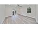 Spacious bedroom with wood-look floors and private balcony at 1906 Cherry W St # 1, Tampa, FL 33607