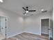 Bright bedroom with wood-look floors and ceiling fan at 1906 Cherry W St # 1, Tampa, FL 33607