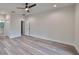 Bright bedroom with wood-look floors and ceiling fan at 1906 Cherry W St # 1, Tampa, FL 33607