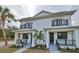 Modern duplex with front porches, landscaping, and a clean design at 1906 Cherry W St # 1, Tampa, FL 33607