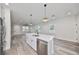 Open concept kitchen with island, stainless steel appliances, and white cabinets at 1906 Cherry W St # 1, Tampa, FL 33607