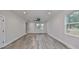 Bright living room featuring wood-look floors and recessed lighting at 1906 Cherry W St # 1, Tampa, FL 33607