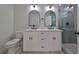 Elegant bathroom with double vanity, marble countertop, and walk-in shower at 1906 Cherry W St # 2, Tampa, FL 33607