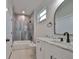 Modern bathroom with white vanity, marble countertop, and gray tile shower at 1906 Cherry W St # 2, Tampa, FL 33607