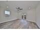 Bright bedroom with wood-look floors and private balcony access at 1906 Cherry W St # 2, Tampa, FL 33607