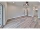 Bright bedroom with wood-look floors and private balcony access at 1906 Cherry W St # 2, Tampa, FL 33607