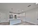 Modern white kitchen with stainless steel appliances and marble countertops at 1906 Cherry W St # 2, Tampa, FL 33607