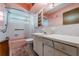 Retro bathroom with pink tile and built-in vanity at 2315 Nash St, Clearwater, FL 33765