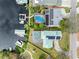 Aerial view of waterfront homes with pools and docks on a canal at 1104 Kingfish Pl, Apollo Beach, FL 33572