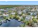 A picturesque waterfront home featuring a private dock, screened in pool, and lush landscaping with easy canal access at 1104 Kingfish Pl, Apollo Beach, FL 33572