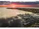 Picturesque marina at sunset, filled with boats, calm water, and a beautiful horizon, ideal for boating enthusiasts at 1104 Kingfish Pl, Apollo Beach, FL 33572