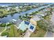 Aerial view of beautiful waterfront homes with private docks and boat lifts on the canal at 1104 Kingfish Pl, Apollo Beach, FL 33572