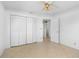 Bedroom featuring a ceiling fan, closet with louvered doors, and tiled floors at 1104 Kingfish Pl, Apollo Beach, FL 33572