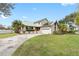 Charming two-story home with a landscaped yard, two car garage and green metal roof at 1104 Kingfish Pl, Apollo Beach, FL 33572