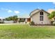 Charming home with a well-manicured lawn and lush landscaping, creating an inviting curb appeal at 1104 Kingfish Pl, Apollo Beach, FL 33572