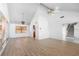 Spacious living room featuring vaulted ceilings, wood floors, and ample natural light at 1104 Kingfish Pl, Apollo Beach, FL 33572