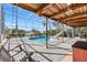 Covered pool area with a slide and views of the water at 1104 Kingfish Pl, Apollo Beach, FL 33572