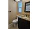 Bathroom with granite countertop vanity, toilet, and tiled floor at 11933 72Nd Ave, Seminole, FL 33772