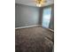 Bedroom with gray walls, ceiling fan, and wall-to-wall carpeting at 11933 72Nd Ave, Seminole, FL 33772