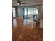 Living area with hardwood floors and access to a sunroom at 11933 72Nd Ave, Seminole, FL 33772