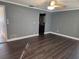 Spacious living room featuring dark gray walls and wood-look flooring at 11933 72Nd Ave, Seminole, FL 33772