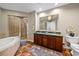 Bathroom featuring a soaking tub, a walk-in shower, and granite countertops at 1209 E Cumberland Ave # 508, Tampa, FL 33602