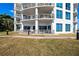 Exterior shot showcasing balconies, the building's architecture and landscaping at 1209 E Cumberland Ave # 508, Tampa, FL 33602