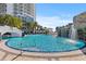 Enjoy the refreshing pool with a rock waterfall, palm trees and lounging areas near the condominium building at 1209 E Cumberland Ave # 508, Tampa, FL 33602