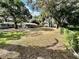 Spacious backyard with large grassy area, providing ample outdoor space at 16615 Us Highway 41, Spring Hill, FL 34610