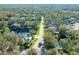 Aerial view of community with pool and lush landscaping at 270 Pinewinds Blvd, Oldsmar, FL 34677