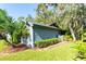 Gray house with attached garage and landscaped yard at 270 Pinewinds Blvd, Oldsmar, FL 34677