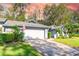 Home exterior showcasing the garage and driveway at 270 Pinewinds Blvd, Oldsmar, FL 34677