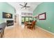 View of the living room, dining area, and access to the back patio at 270 Pinewinds Blvd, Oldsmar, FL 34677