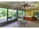 Hot tub and small table in a screened porch at 270 Pinewinds Blvd, Oldsmar, FL 34677