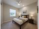 Cozy bedroom with a queen-size bed and wood frame at 30200 Southernwood Ct, Wesley Chapel, FL 33543