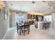 Modern kitchen with stainless steel appliances, an island, and dark brown cabinets at 30200 Southernwood Ct, Wesley Chapel, FL 33543