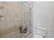 Shower stall with glass door and tiled walls at 605 Casabella Cir, Tampa, FL 33609