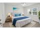 Bright bedroom with a comfortable bed, nightstands, and a ceiling fan at 1524 Lakeview Rd # 103, Clearwater, FL 33756